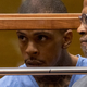 Eric Holder in custody while appearing in court in Los Angeles with now-former attorney Chris Darden (right)